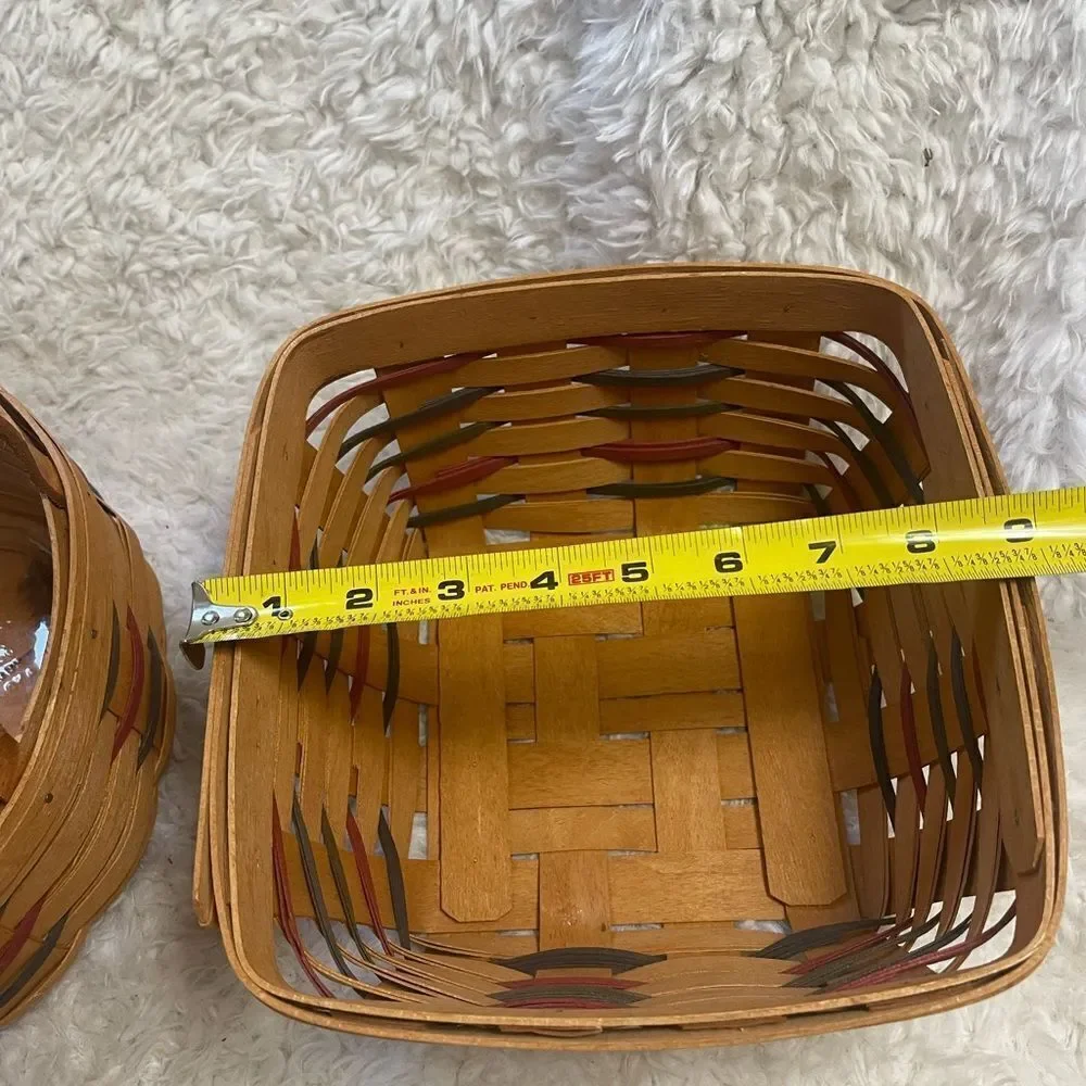 Longaberger 1995 set of two Handcrafted round and Square Woven baskets .